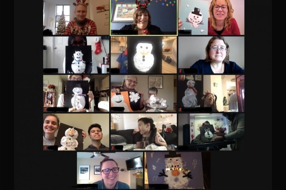 Photo of a collage of 14 individuals holding up their snowman crafts for the Zoom activity.